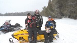 Above: Ready to get back on the trails were Bradley VanDoren, Koery Thoreson, and Bryan VanDoren.