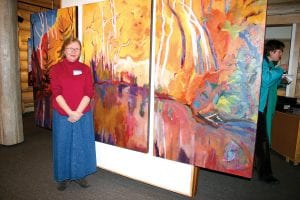 Artist Margaret Carroll at the opening of her show at Johnson Heritage Post, which will run through April 23. Carroll lives in the Twin Cities but has a special love for the Gunflint Trail and creates a lot of paintings of the Northwoods.