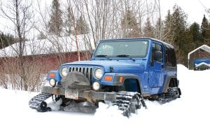 On March 22, 2011, the rather peculiar tracks on this Jeep (above) carried it through several feet of snow that had been accumulating undisturbed all winter. Stan Tull of Track Vehicle Solutions distributes them locally and expects them to be just as useful during mud season.