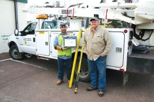 Grand Marais Public Utilities Commission lineman Matt Bronikowski and Line Superintendent Mike Taylor pose with the safety award their department won from the American Public Power Association for 2010. The award recognizes the department “for meritorious achievement in attaining a low accident frequency during the year 2010.” This was a first-place award for systems with fewer than 15,000 worker hours of exposure. Not pictured is lineman Jeff Eliasen, the other member of the crew.