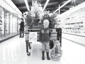 Kaleb Berka, age 3, won an Easter basket almost as big as he is in the Johnson Foods Easter coloring contest.