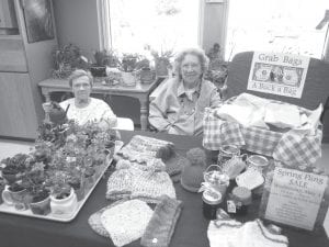 Joyce Kehoe and Irma Larsen helped promote a Spring Fling Sale at the Care Center on May 4. It took many weeks for residents to prepare knitted hats, scarves, potted plants, soup in a jar, baked goods, and grab bags for the sale. There were some white elephant items, too. The Resident Council members sponsored the sale and plan to do it again.