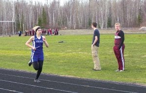 Above: Molly Zafft powered through her leg of the 4x400 meter relay for the Vikings. The girls finished 3rd overall in a great early season time of 4:42.