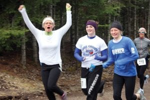 Jana Larson’s joy is evident in this picture. Joining Jana is Viking athlete Kristina Rude (center) and Jana's daughter Ailee Larson. Although smiling, they didn’t seem to be quite as happy as their mom. Ailee is blessed with great running talent, but 13 miles into the teeth of a cold, strong wind was a bit much for even the most experienced runner on this day.