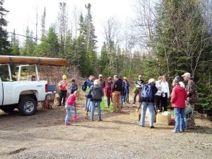 Before volunteers headed out to plant trees, US Forest Service staff gave instructions on tree planting procedures. There were about 30 Forest Service staff members and community volunteers overseeing the planting. At the end of the day, almost 10,000 seedlings had been planted in the Ham Lake Fire area. And, at the end of the day, folks enjoyed dinner at the Big Top at Gunflint Lodge and dancing to Trail’s End Band.