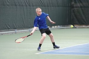 Only an eighth-grader, Lars Scannell has won most of his matches against older opponents this year at the Vikings No. 2 singles spot. Here Scannell returns a winner against Kyle Stupka of Duluth Central-Denfeld Trojans. Lars won his match 6-2, 6-2.