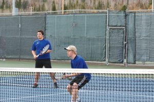 Left: Playing at No. 1 doubles for the Vikings, Colin Berglund, at the net, and Justin Goldstein defeated their Duluth opponents 6-1, 6-2.