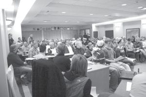 It was standing room only in the Cook County commissioner’s room on Tuesday, May 10 when the Cook County Community Center Steering Committee presented preliminary plans for a new community center facility. Over 100 people crowded into the room, spilling out into the hallway. Thirty-three citizens asked questions or made comments on the plan.