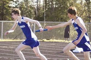 The Cook County Track team had a great time at their second outdoor meet of the season in Two Harbors on Tuesday, May 3. Eighth-grader Alex Smith passes the baton to Sophomore Bjorn Johnson. With teammates Cy Fortunato and Nate Carlson, the young sprinters finished 4th in the 4x200 at 1:59.9.