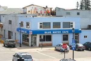 Demolition began this week on the building that once housed the Shore Theater in downtown Grand Marais. The old movie theater has sat vacant for many years. The demolition is being done by Crawford Excavating. Rick Crawford said he anticipates being done with the project by next Friday.