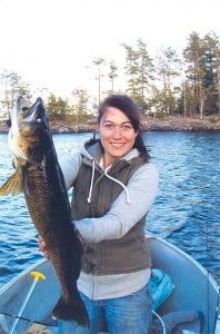 Robyn Ekroot shows off the 12-pound, 31-inch walleye she caught and released on Sag near Jocks Narrow.