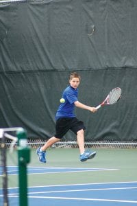 Above: Pete Summers is only in 7th grade but he plays at the No. 3 singles position for the Vikings' varsity tennis team. Here he returns a shot against Eveleth-Gilbert Sophomore Colten Hennis. Summers lost the match but continues to improve against his older, more experienced opponents. The Vikings, playing without a full roster, lost the match 5-2. Right: Junior David Bergstrom is still undefeated as the Vikings No.1 singles player. Bergstrom beat Steve Aro of Eveleth-Gilbert 6-1, 6-1, on Tuesday, May 10 at home.