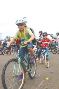 Rolling into spring! The Cook County Bike Safety Rodeo at the Cook County Community Center on May 12 helped local kids get ready for safe bike riding this summer. The weather was great for the 109 kids who came out to ride the safety course and have their helmets and bicycles checked and adjusted. See more bike fun on page A4.