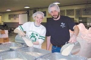 Deb and Steve Veit worked with the youth groups to plan the event and then took part in doing the actual work itself. Their smiles reflected those of most of the volunteers who helped with the Feed My Starving Children project.