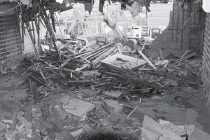 Above: It has been interesting to watch the dismantling of the historic Shore Theater building on Wisconsin Street in Grand Marais. At press time, most of the demolishing is taking place at the rear of the building. Right: A remnant of days gone by, an RCA movie projector. The Cook County Historical Society is working with building owner Bruce Leng to obtain the old film equipment.