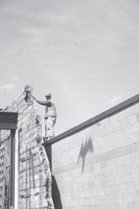 Far right: Seagulls with young on the roof of Sivertson’s Gallery rooftop hovered menacingly when a Crawford Excavating worker assesses the old theater wall.