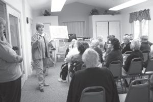 County Commissioner Sue Hakes, chair of the Community Center Steering Committee, answers questions at the meeting at the Cook County Senior Center on Thursday, May 19. Of the approximately 50 people in attendance at the meeting, no one spoke in favor of moving the senior center to the proposed new community center. Hakes told the crowd that whether or not the senior center is part of the community center, the steering committee wants input from the county’s senior citizens.