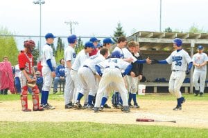 The whole cook county high school baseball team came out to greet Colin Everson after his might homerun against the Ely Timberwolves last week. Unfortunately the team lost the game 5-4.