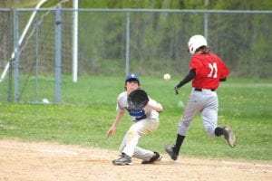 As Joe Borud looks the ball into his glove he sticks his tongue out at the Ely runner. No, he wasn’t mocking his opponent, it’s a “Michael Jordan” habit. Remember, Jordan also played pro baseball.