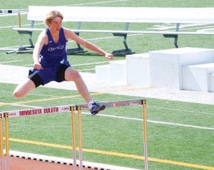 Although he didn’t make it to sections, Kyle Martinson (above) ran his best time of the year in the 110 high hurdles at subsections and Kara Ramey (right), relay stick in hand, helped the 4x400 relay to a time of 4:32 and a fifth place finish. The Vikings will send 8 kids to the section meet and if they finish in the top two, they will advance to the state meet. Last year Kieran Scannnell (2 mile) and Ailee Larson (800 meters) qualified for state. Both hope to return this year and both should have a good chance of placing.