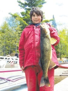 Left: Gunflint Pines Resort saw some successful fishermen last week. Brian “Bubba” Finke of Grand Marais caught and released a nice 29.5-inch walleye on Gunflint Lake. His guides were Jaret and Wyatt Baker.