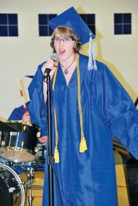 Songs and speeches. Left: Sarah Warren sang Don’t Forget Your Name, a song about teenage angst and facing the future. Above: Guest speaker Marie Helbach tearfully recalled the Class of 2011 as her first teaching assignment.