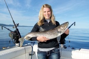 Newlywed Courtney Swenson of Zumbrota, MN had an awesome day of fishing on Lake Superior with Captain Darren Peck of Tofte Charters. The 13-pound, 36-inch lake trout was released.