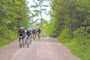 Riders in the Saturday, June 11 Lutsen99er were challenged by the climbs and sometimes-rugged terrain. However, they were also rewarded by some sections that were smooth and scenic like this stretch of Bally Creek Road.