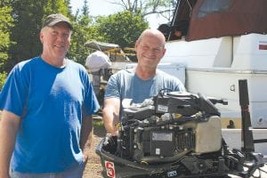 Rick Austin (right) and Randy Ekroot have started an inboard/ outboard boat motor repair shop near the entrance of the new Gunflint Trail in Grand Marais. The partners have only recently opened their doors but have been happy with the business and well-wishers who have stopped by. Called A&E Marine, they are located at 108 Gunflint Trail on the old Tilbury property.