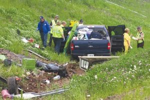 A pickup truck towing a boat went off the road in Tofte on Friday, July 1, scattering camping and fishing gear along the road and in the ditch along Highway 61.