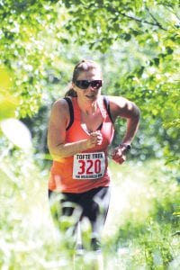 The first woman walker across the finish line—Ellen Anderson of Grand Marais—sprinted in the final stretch, coming in with a time of 1:14:20.6, a pace of 11.57 per mile.