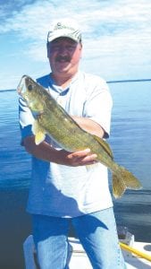 Left: News-Herald Publisher Hal Kettunen had great luck while fishing at High Banks Resort on Lake Winnibigoshish over the 4th of July weekend. He got this 27.5-inch walleye on Sunday, July 3, using a Lindy rig and crawler in 21 feet of water.