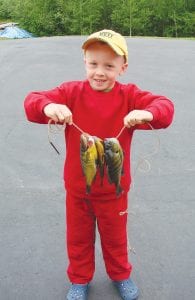 Paul Dorr shows off his first catch of sunfish.