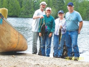 Mike and Val Littfin of Grand Marais and Brian and JoAnn Smith of Grand Marais enjoyed a June Boundary Waters Canoe Area Wilderness (BWCAW) trip. They had a great time, seeing lots of wildlife—moose and turtles!—and they caught a lot of fish, enjoying shore lunch throughout the week.