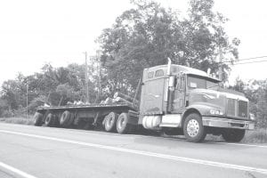 This International truck lost its brakes coming down the Caribou Trail on Thursday, July 14. The driver, Stacey Kelly, 44, Eveleth, was able to slow the vehicle enough to come to a halt on Highway 61, but the load of logs on the trailer broke loose. Fortunately no one was injured and traffic was able to continue to use one lane of the highway while cleanup took place.