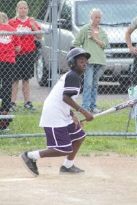 Far left: Sam O’Phelan watches the ball go, go, go, as he gets ready to run the bases. O’Phelan hit for a double on this play.