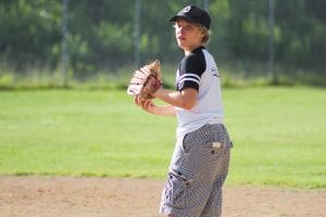 Left: Noah Roth warms up for the game. Both boys had great Little League seasons.