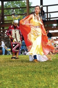 Grand Portage Royalty Autumn Clearwater- Day and Jaden Aubid of Grand Portage dance at the Grand Portage Traditional PowWow.