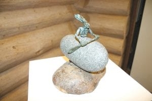 Artist Wayne Potratz had on display numerous bronze, wood and stone sculptures of intriguing figures paddling canoes.