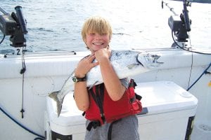 Above: Jasper Matz, 9, from Deephaven, Minnesota caught this 10-pound, 31-inch king salmon on July 28 while fishing with Captain Darren Peck of Tofte Charters. Captain Peck said Jasper fought the fish from beginning to end all by himself.