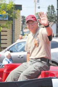 Right: Dan Baumann of Golden Eagle Lodge was recognized as Citizen of the Year for his work in the tourism industry, with the Gunflint Trail Volunteer Fire Department and as a mentor to local Boy Scouts. He was nominated for his positive attitude, which was apparent as he enjoyed a ride in the parade.