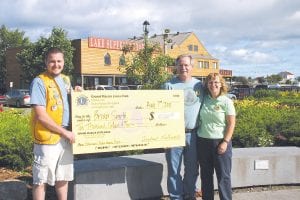 The lucky grand prizewinner in the Grand Marais Lions Club Fisherman’s Picnic raffle was Brian Smith of Grand Marais— pictured here with his wife, JoAnn, who actually purchased the ticket and put Brian’s name on it. The couple said they would share the $10,000 winnings.