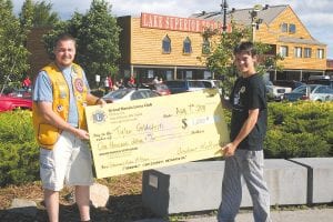 Another happy prizewinner is Tyler Goldstein of Grand Marais, who won $1,000. Grand Marais Lions Club Fisherman’s Picnic Chairman Andrew Smith was happy to present the big checks.