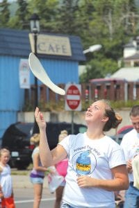 Sven & Ole’s Pizza didn’t just throw candy in the parade— they tossed pizza dough!