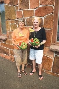 Fisherman’s Picnic kicks off with the Grand Marais Lioness Club Fishcake Buffet Dinner on Wednesday night. Welcoming guests are beautiful carved watermelon fruit baskets Lionesses Mary McElevey and Barb Erickson show off this year’s centerpieces. The fishcakes, as always, were delicious!