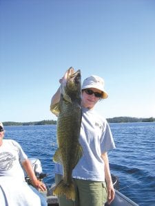 Brad and Darlene Ludlow had a great weekend of fishing with Mike Berg of Seagull Creek Fishing Camp on July 29-30, earning spots on the fishing camp’s “Hawg Board.” Above: Darlene Ludlow caught the first big fish on Friday, July 29, this beautiful 29-inch walleye. Brad said, “It is by far the biggest fish that Dar has ever caught and her first master angler walleye.” Left: Not to be outdone, Brad Ludlow caught another monster walleye the next day, this 30-inch beauty.