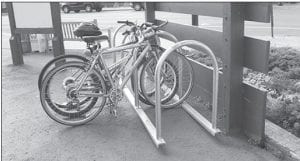 The Grand Marais City Council passed a resolution in January 2011 to support active living in the city. The Grand Marais Parks Department has taken the lead on this and working with the State Health Improvement Program (SHIP) recently installed seven bike racks in downtown Grand Marais. This rack, in the Joynes’ Ben Franklin parking lot, has been put to good use.