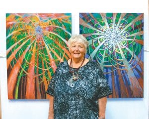 Grand Marais artist Alice Powell greeted patrons who attended the August 12 opening of her show at the Johnson Heritage Post in Grand Marais. She came to town in 1959 as an art student to take classes from Byron Bradley and Birney Quick at the Grand Marais Art Colony and ended up marrying Milt Powell and raising three daughters here.