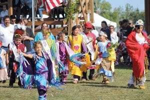 A record number of young people from Grand Portage came out to dance in the Grand Portage Princess and Brave Contest this year. After bravely dancing in front of the large crowd in the PowWow arena, the contestants celebrated as the Grand Portage Stonebridge Singers drummed a special honor song. (L-R) 2011 Tiny Tot Brave John Pierre, Rhonnie Poyirier (in front), Senior Brave Cody Tesser, Ariana Poyirier, 2010 Senior Princess Samantha Scalise, 2010 Senior Brave Jadin Aubid, 2011 Junior Princess Shaelynn Novitsky, 2011 Senior Princess Shianna Lien.