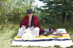 The 2011 Rendezvous Days voyageur encampment at the Grand Portage National Monument was bustling with activity as it likely was in August 1797. This “widow” of a North West Company officer sews lace on a pair of pantaloons for her daughter to wear to the dance at the Great Hall on Saturday evening.